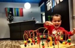 Child playing with toy in waiting area of THINK Institute; pediatric neurology; pediatric and adult healthcare