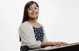 cyfair music and arts; girl playing piano at cyfair music and arts; piano lesson; piano practice; art and music summer camps